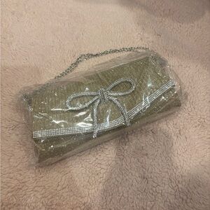 Gold Sparkle Evening Clutch with Chain Strap and Rhinestone Bow and Trim